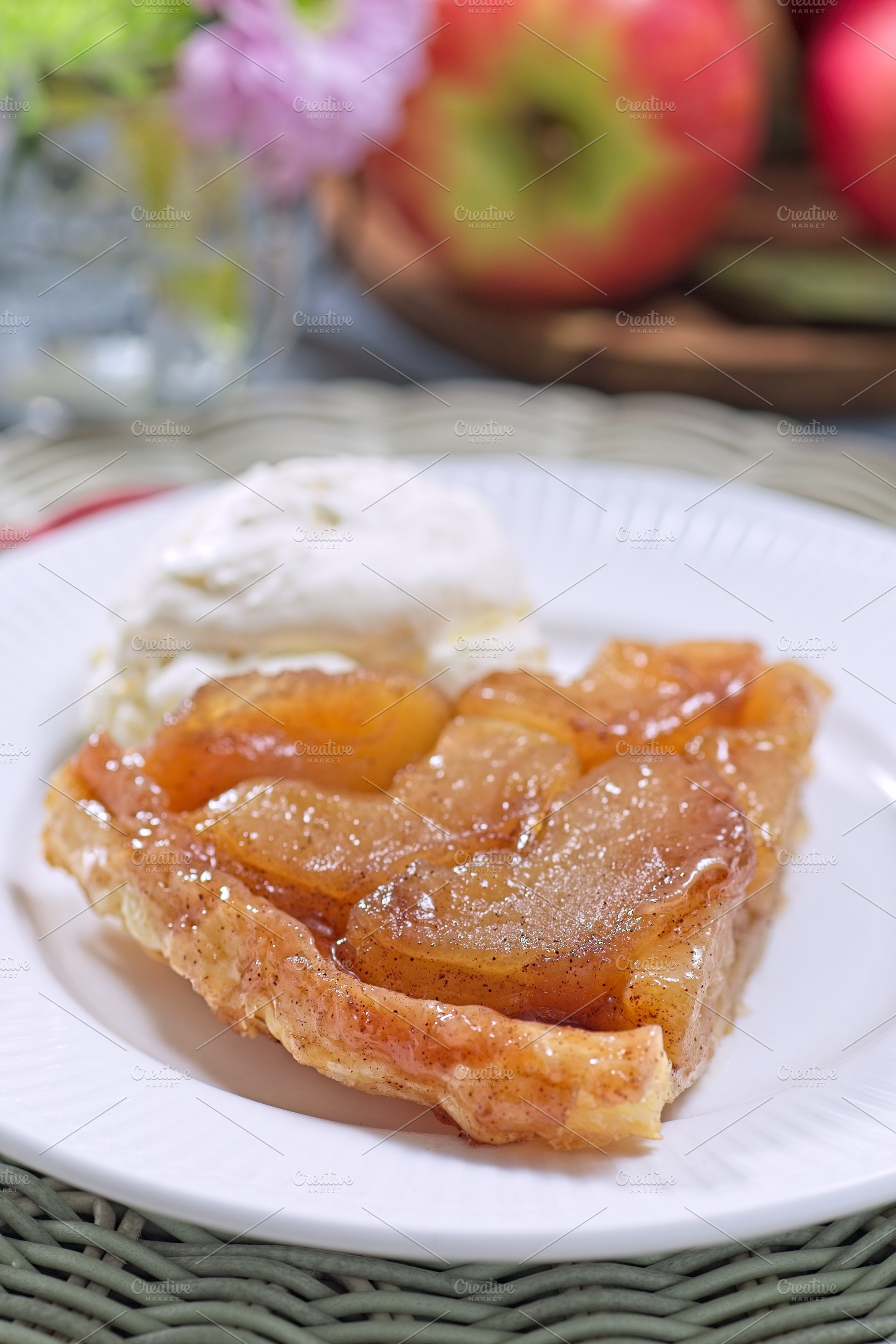 Apple tarte tatin with scoop of whipped cream, french upside down cake, vertica, a Food & Drink Photo by iuliia_n