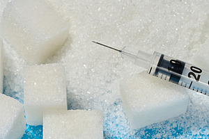 A medical syringe lying on cubes of refined sugar and scattered, a Food & Drink Photo by ndanko