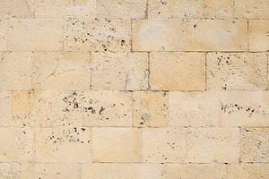 Texture of old limestone brick wall