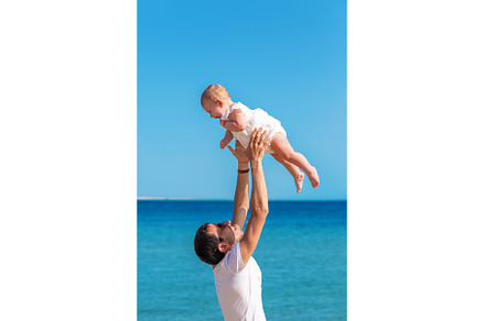 The father tosses the baby against, a Person Photo by yanadjana