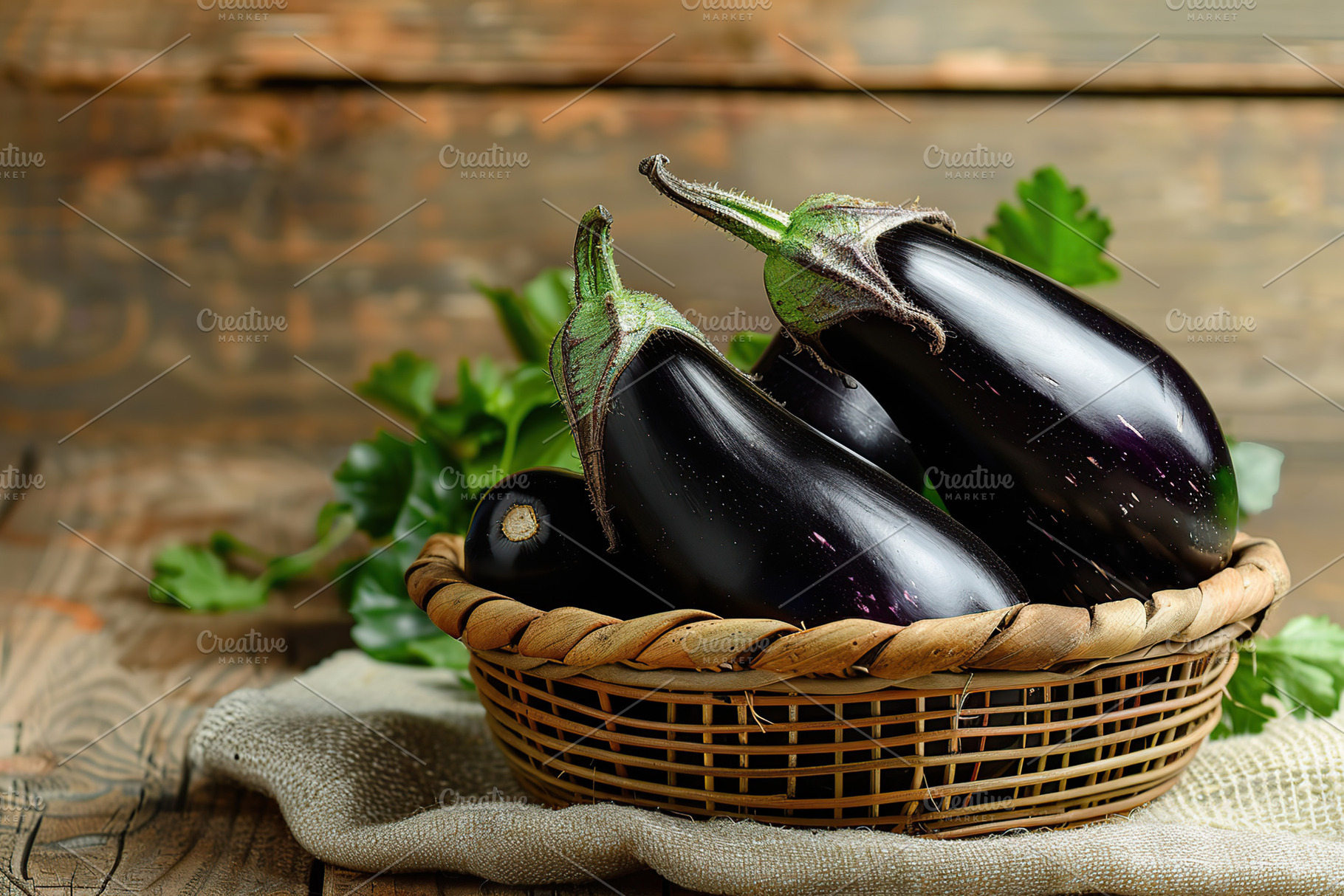 Fresh eggplants in basket on wooden table, a Food & Drink Photo by AlyaAnd