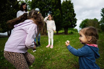 Children playing outdoors in a natural park on a sunny spring day, a Person Photo by AS photostudio