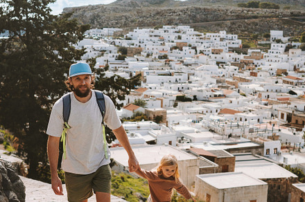Father and child walking in Lindos city family travel in Rhodes island, Greece, a Person Photo by e v e r s t