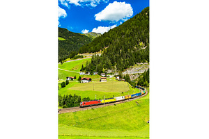 Trucks crossing the Alps by rail in, a Transportation Photo by Leonid Andronov