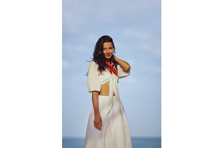 Woman in Elegant Beach Outfit, a Person Photo by Emotion photo