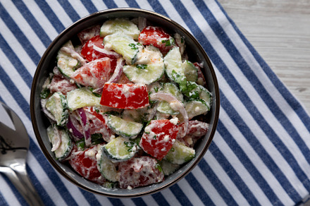 Homemade Tomato Cucumber Feta Salad in a Bowl, top view. Flat la, a Food & Drink Photo by LiudmylaChuhunova