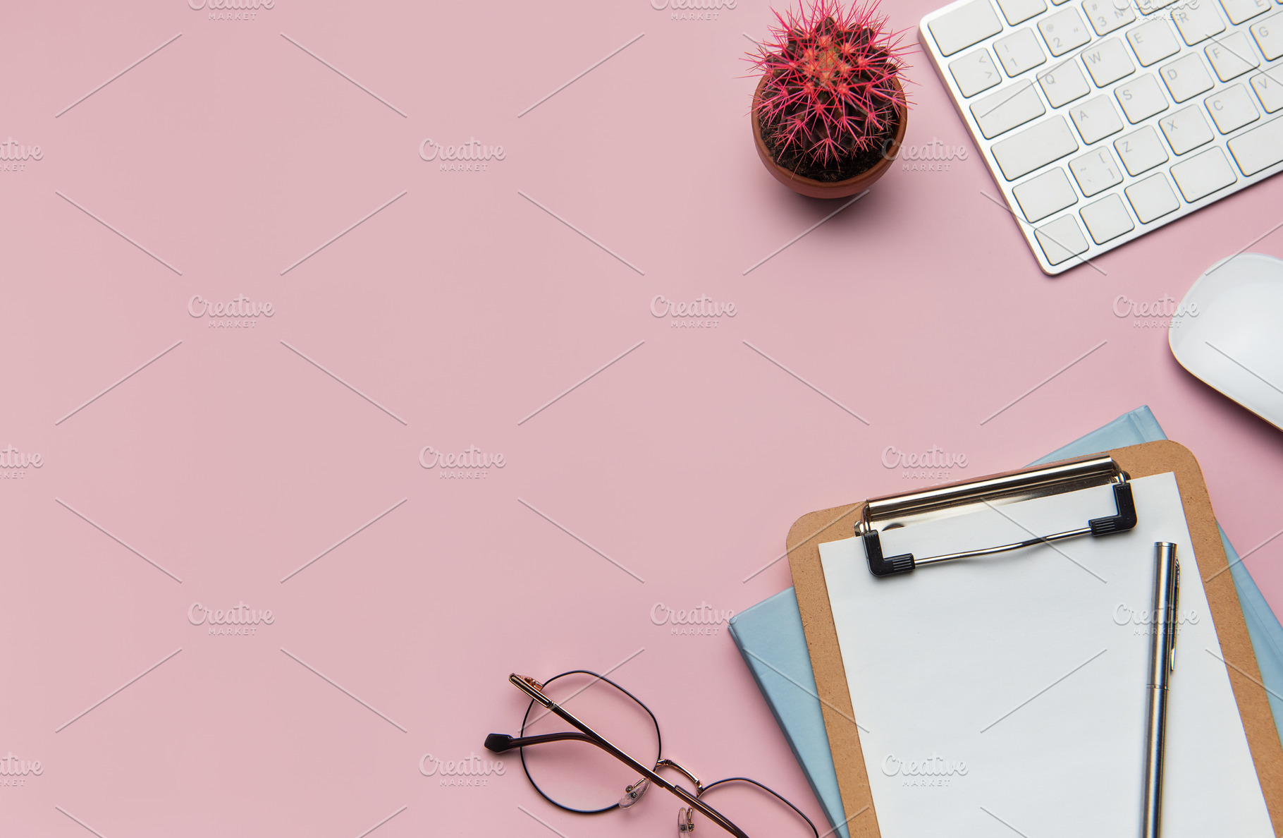 Workspace organizing accessories on pink tabletop for business p, a Business Photo by Olena Rudo