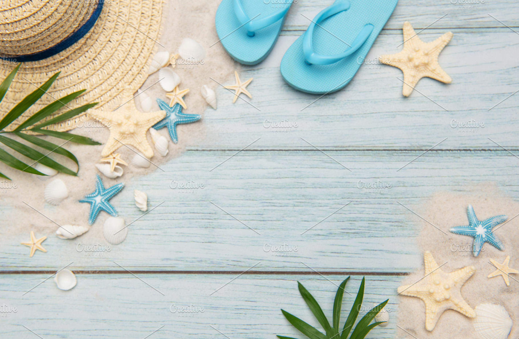 Summer accessories on blue wooden planks evoking beach holidays,, a Holiday Photo by Olena Rudo