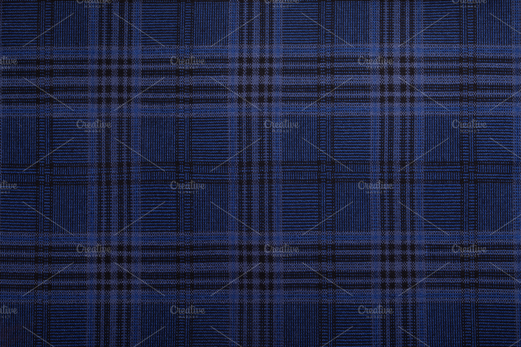 Close-up of a blue and black plaid fabric texture, evenly lit, s, a Background Photo by Ales Munt