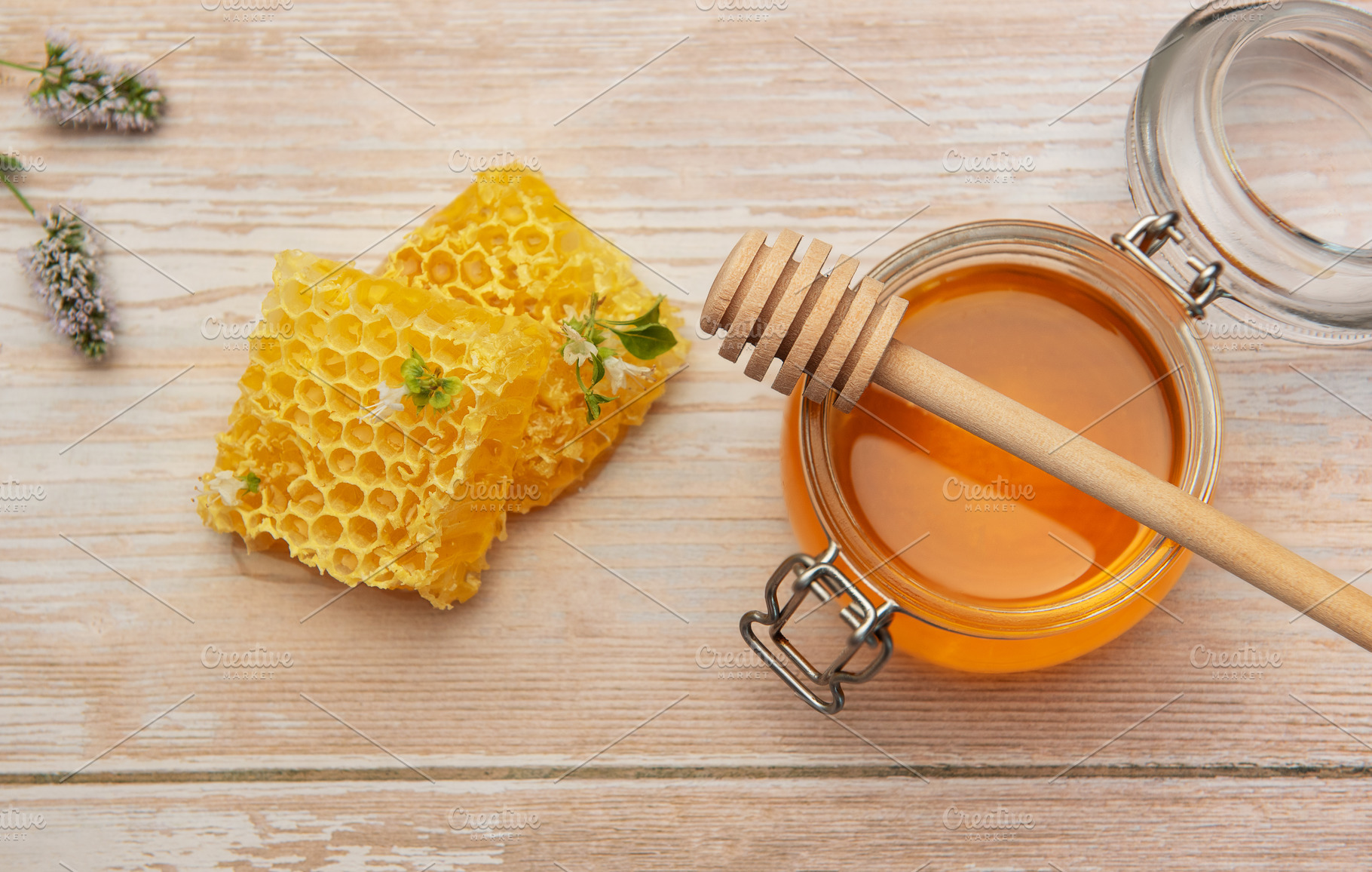 Honeycombs, jar with honey and dipper on wooden table with mint, a Food & Drink Photo by Olena Rudo