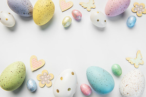 Pastel easter eggs and spring decorations border, a Holiday Photo by Olena Rudo
