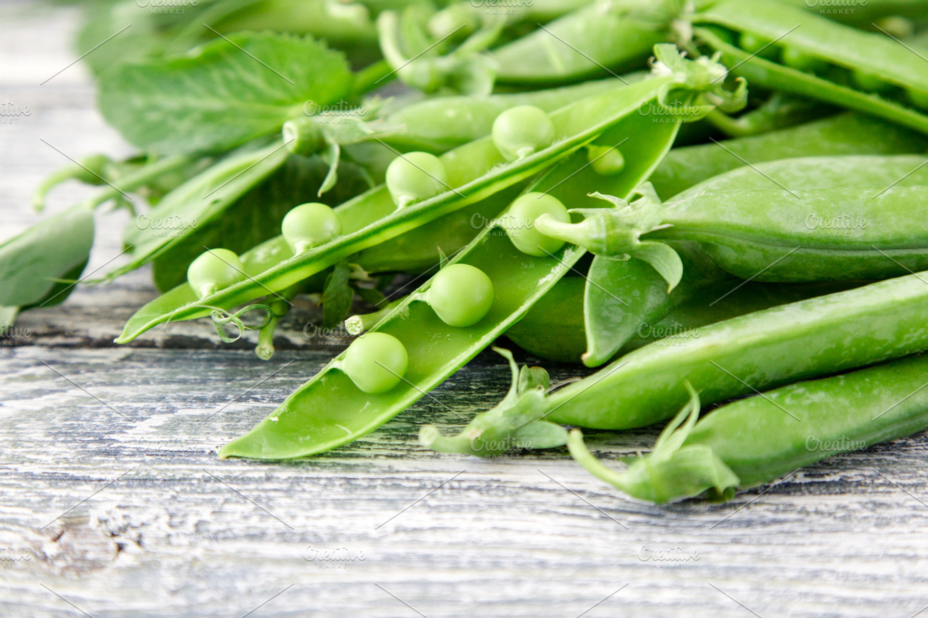 Green peas containing agriculture, background, and bean, a Food & Drink Photo by Ivanna