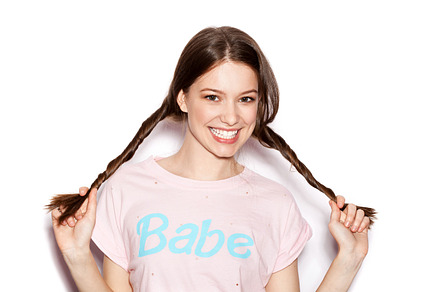 Smiling woman with bright makeup and pigtails featuring background, cheerful, a Person Photo by Aliaksei Kaponia