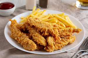 Homemade Chicken Strips with Fries on a Plate, low angle view. C, a Food & Drink Photo by LiudmylaChuhunova