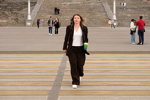 Young woman walking confidently, a Person Photo by Elena Vagengeim