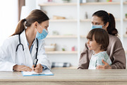 Carefree little boy sitting with mother at clinic and smiling to doctor, woman, a Photo by Prostock-Studio (Thumbnail 2 of 2)