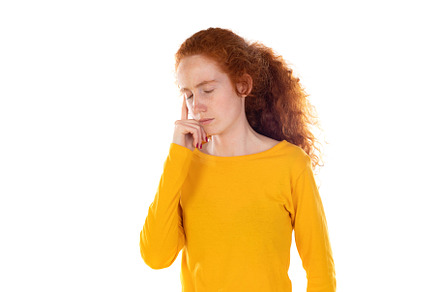 Portrait of pensive redhead girl wearing a yellow t-shirt, a Person Photo by José Manuel Gelpi