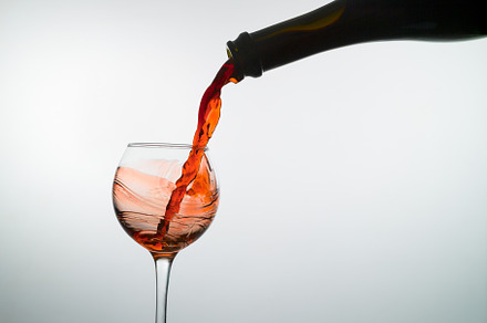 Red wine pouring into a wine glass stock photo containing wine and red, a Food & Drink Photo by oleghz