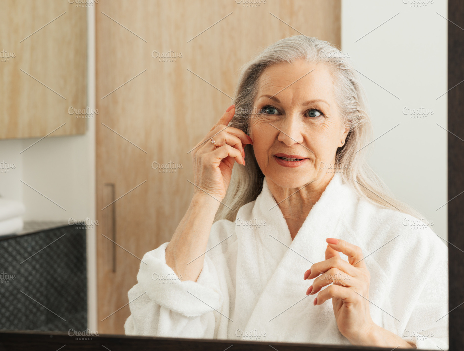 Woman with grey hair in bathroom, a Beauty & Fashion Photo by Artem Varnitsin