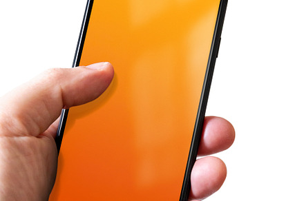 Hand holding a smartphone with blank orange screen. Isolated on, a Technology Photo by GoodGoods