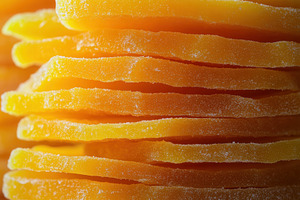 Vibrant orange dried mango slices, a Photo by Pavel_design