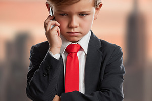 Serious young boy dressed as busines, a Business Photo by MistyDay