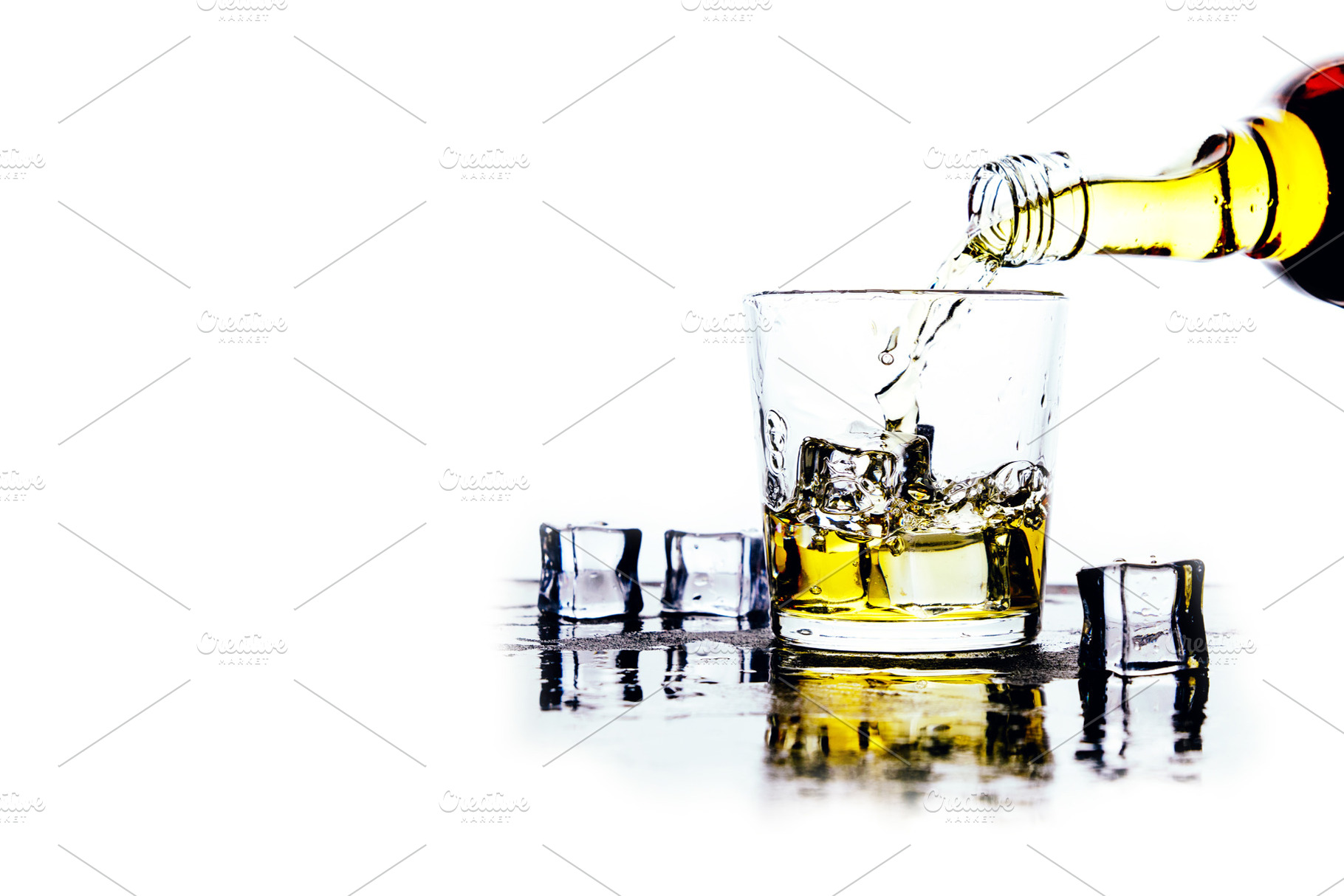 Whiskey pours from a bottle into a g, a Food & Drink Photo by Alekseyliss