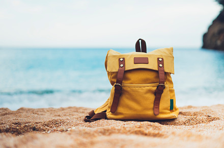 Backpack on the beach stock photo containing backpack and tourist