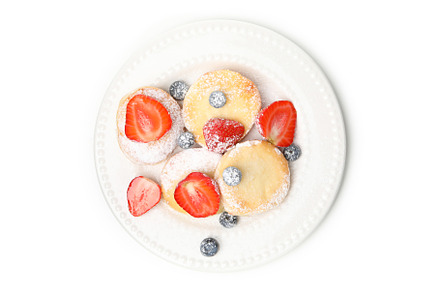 Concept of tasty sweet food, cheese pancakes, isolated on white, a Food & Drink Photo by AtlasStudio PRO