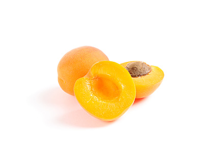 Fresh sweet apricots isolated on white background, a Food & Drink Photo by AtlasStudio