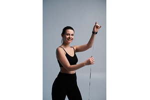 Young woman smiling, holding a, a Sports & Recreation Photo by volodymyrshtun13795