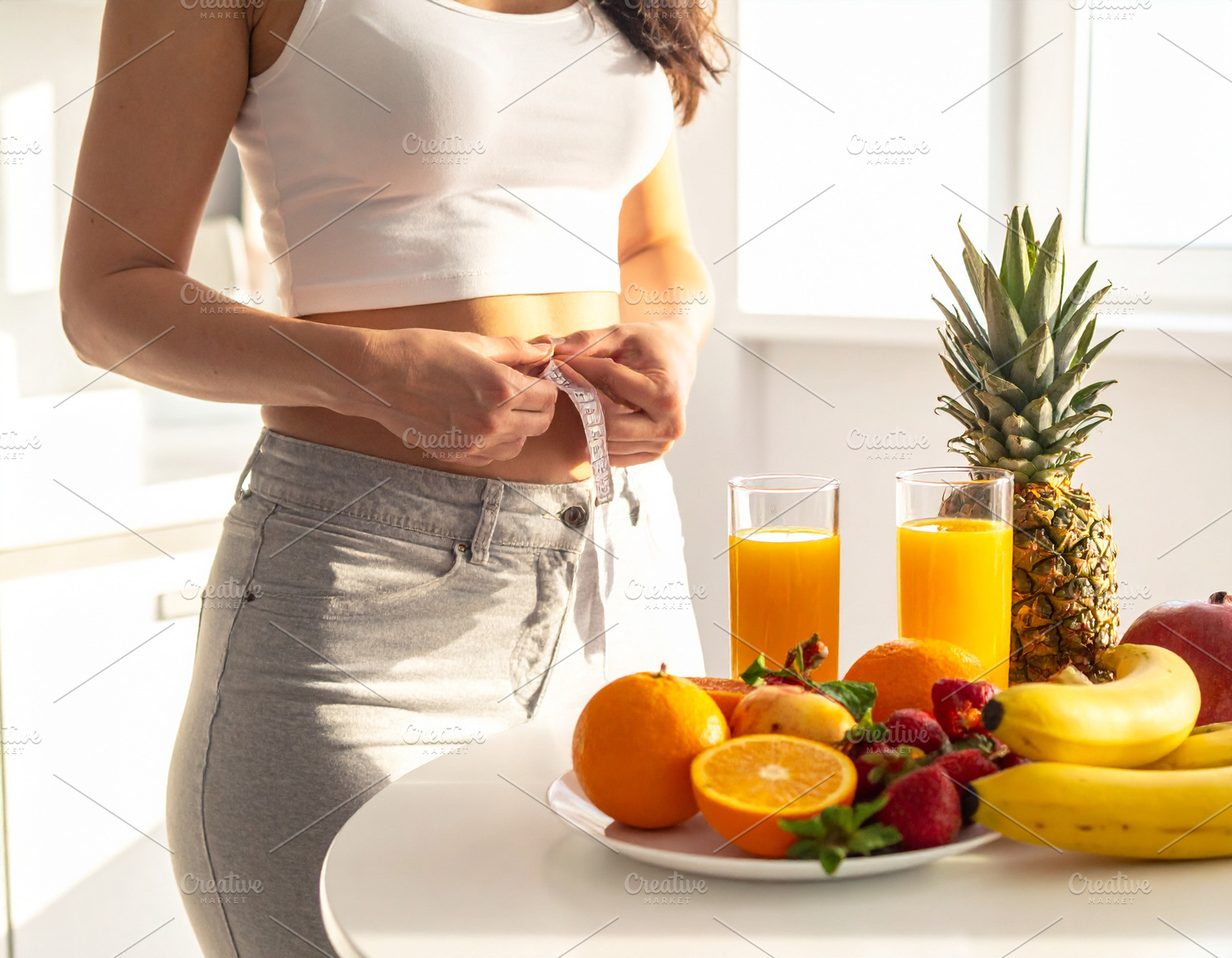 Fit woman with fresh fruits for a healthy diet, a Health & Medical Photo by DanFLCreativo