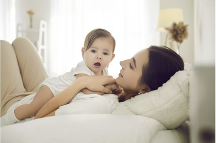 Happy young mother together with her, a Person Photo by StudioRomantic