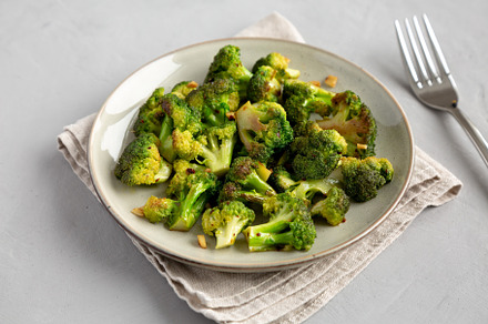 Homemade Pan-Fried Broccoli on a Plate, side view., a Food & Drink Photo by LiudmylaChuhunova