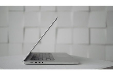 Side view of new laptop on white, a Technology Photo by Media Whale Stock