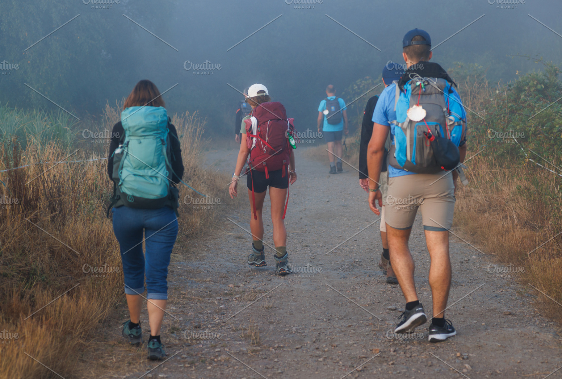 Pilgrims Walking on Foggy Dirt Road, Camino Primitivo, Spain, a Person Photo by Bepslabor