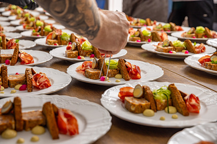 Chef decorating a starter plate, a Photo by Grafvision photography