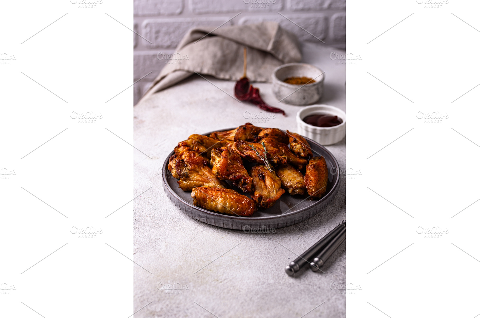 Baked spicy chicken wings with sauce, a Food & Drink Photo by Yulia Furman