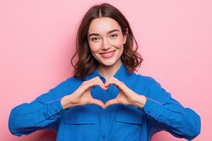 Girl expresses love with heart, a Photo by Beautiful things