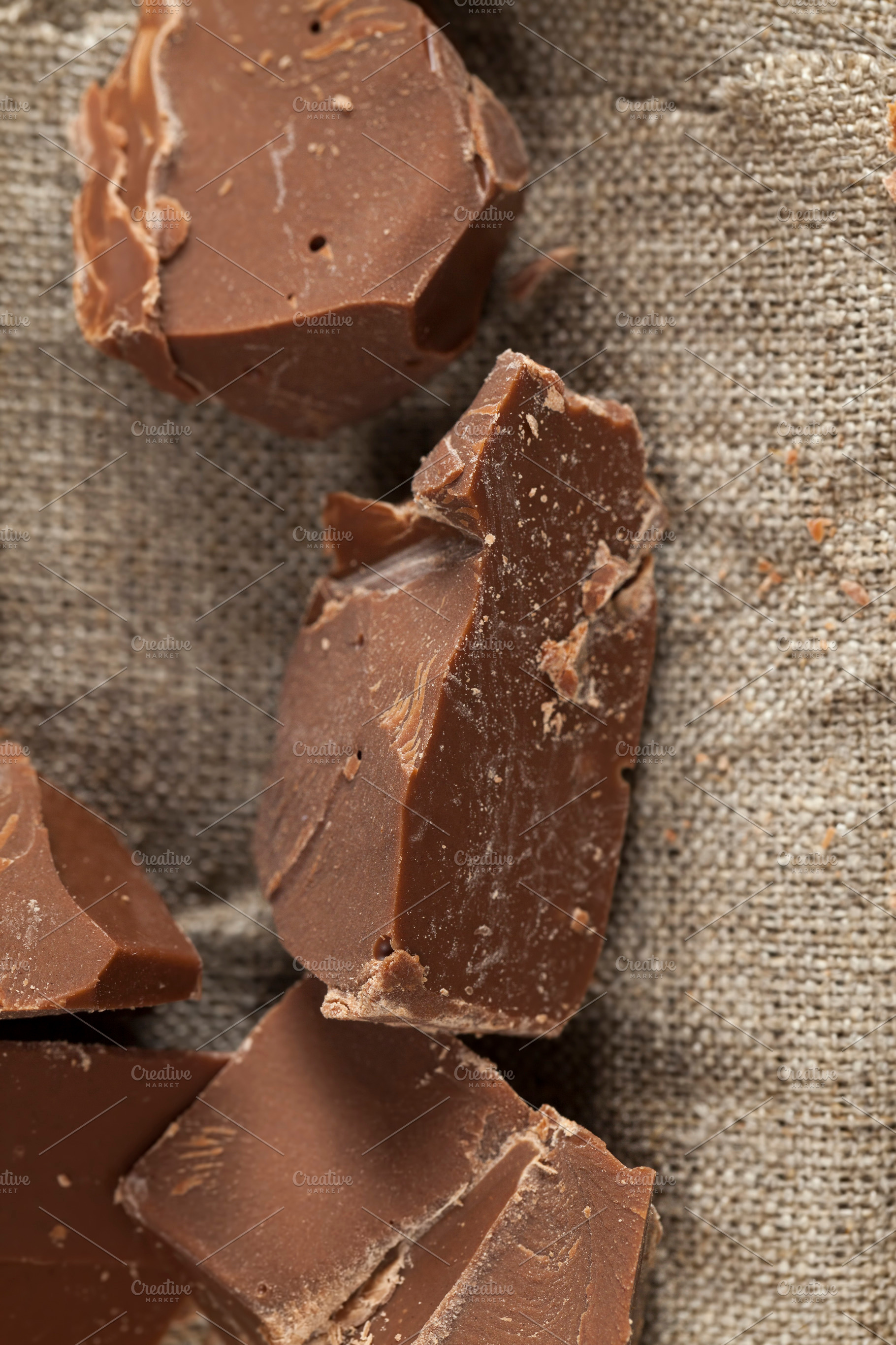 broken into several parts pieces of chocolate from cocoa, a Photo by MyPhotos