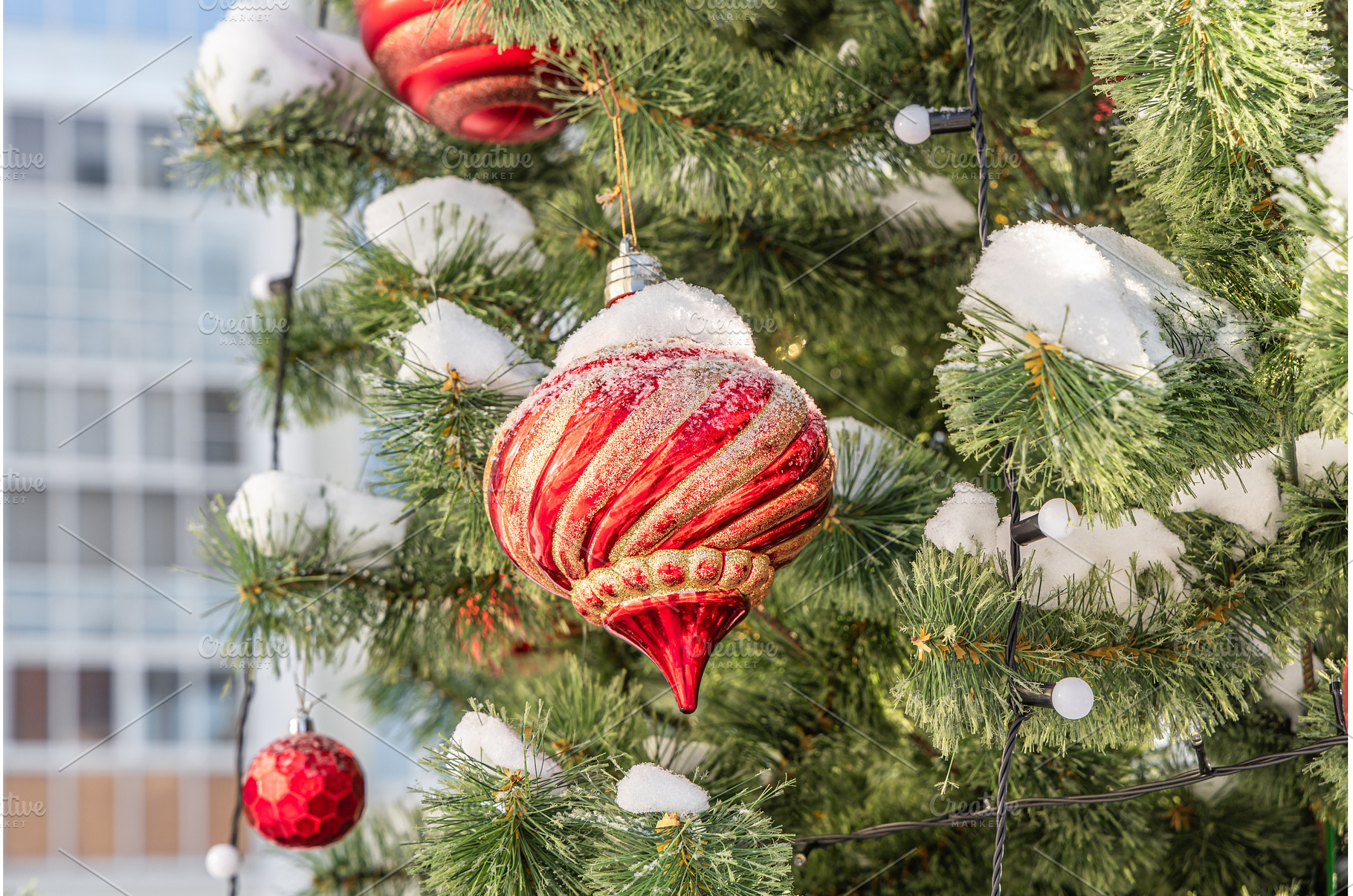 Green plastic Christmas tree outside, a Holiday Photo by Illustrations&photos