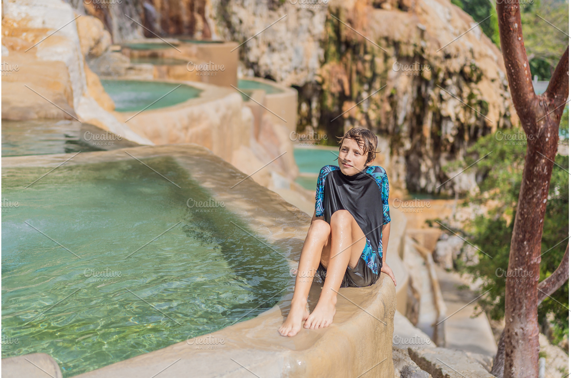 Young boy tourist bathing in the hot, a Holiday Photo by Elizaveta Galitskaya