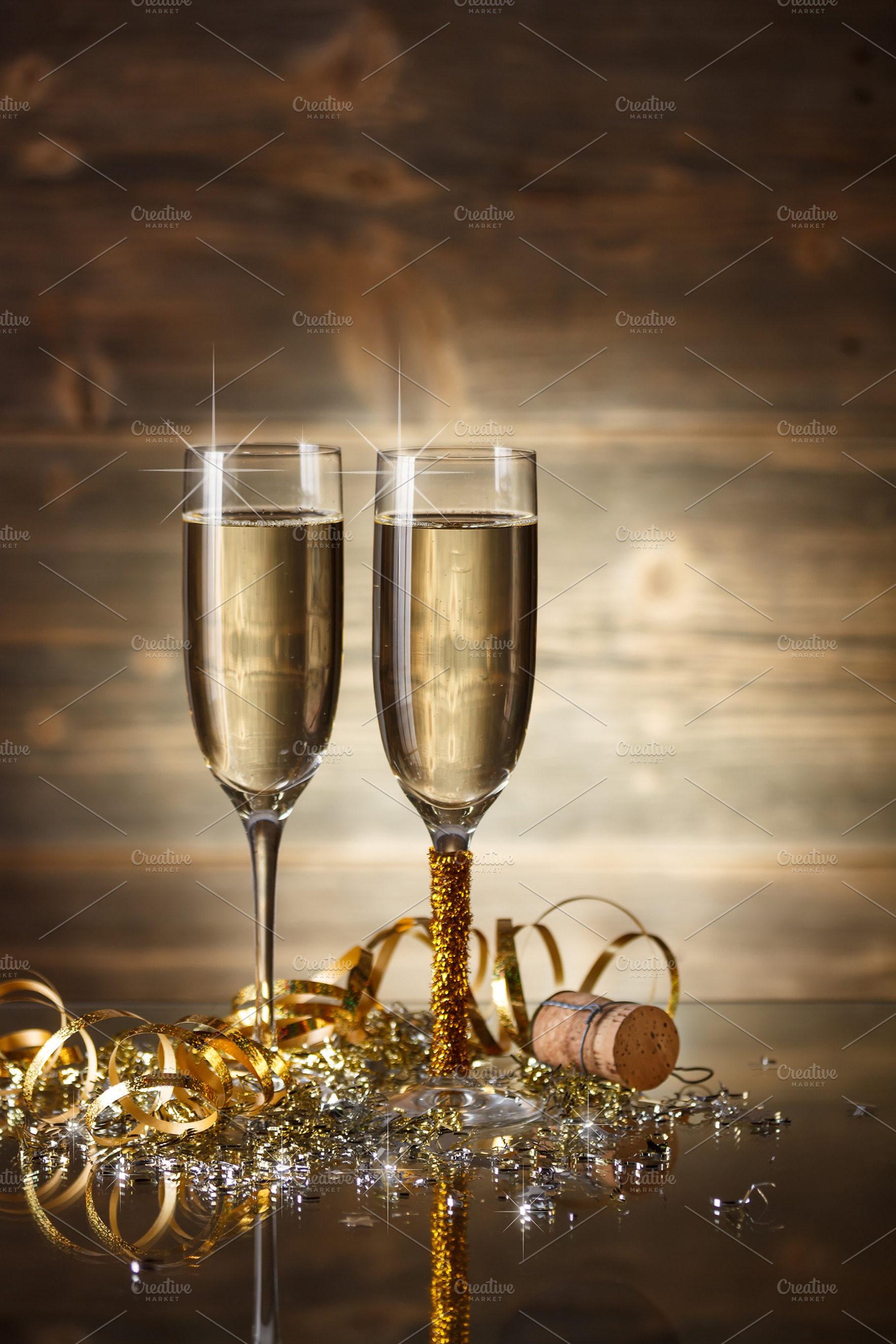 Glasses of champagne containing new, year, and ornament