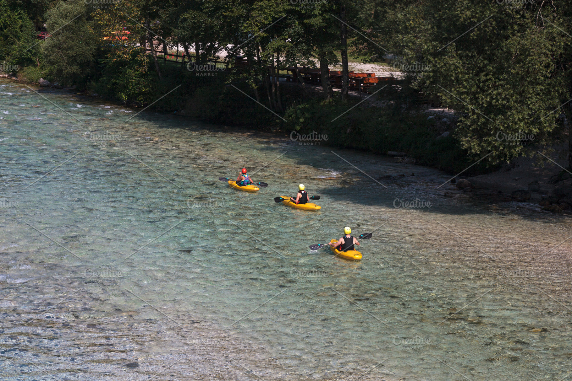 Sporty kayakers on the beautiful turquoise Soca river, Bovec, Slovenia, a Sports & Recreation Photo by Bepslabor