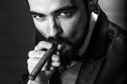 Smoking gentleman portrait featuring adult, attractive, and background, a Person Photo by Ales Munt