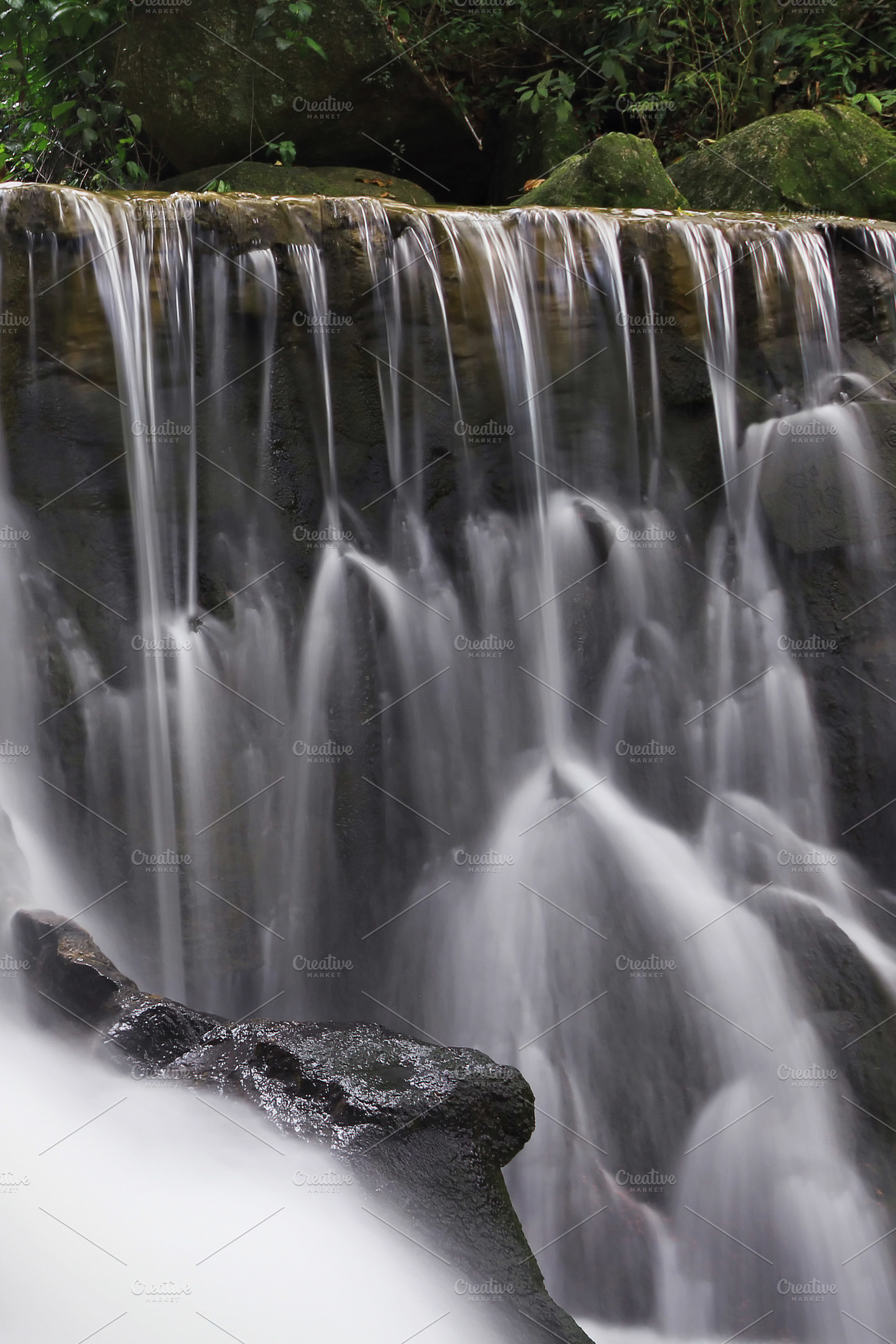 Beautiful waterfall in the jungle, a Photo by saiko3p