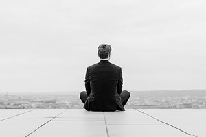 Businessman sitting alone on rooftop, a Business Photo by MistyDay