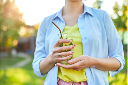 Woman drinking summer citrus, a Food & Drink Photo by IlliaBondarPhotography