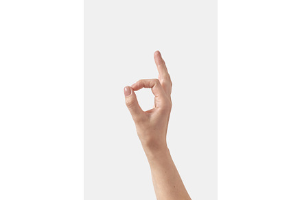Close up OK gesture woman hand on, a Person Photo by Yaroslav Danylchenko