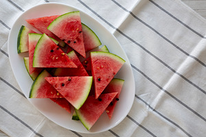 Raw Organic Watermelon Slices on a Plate, top view. Copy space., a Food & Drink Photo by LiudmylaChuhunova